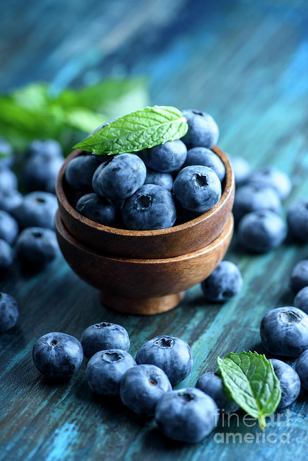 Fresh Blueberries in wooden bowl close up Photograph by Jelena Jovanovic