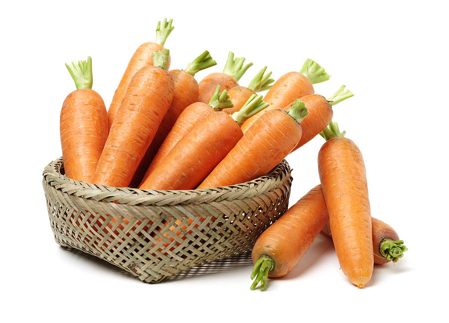 Fresh carrot on a white background Photograph by Chengyuzheng