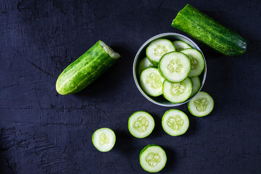 Fresh Cucumber for Health on black ground Photograph by Narong KHUEANKAEW