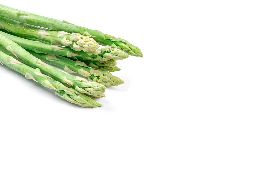 Fresh green asparagus on white Photograph by Aedkais