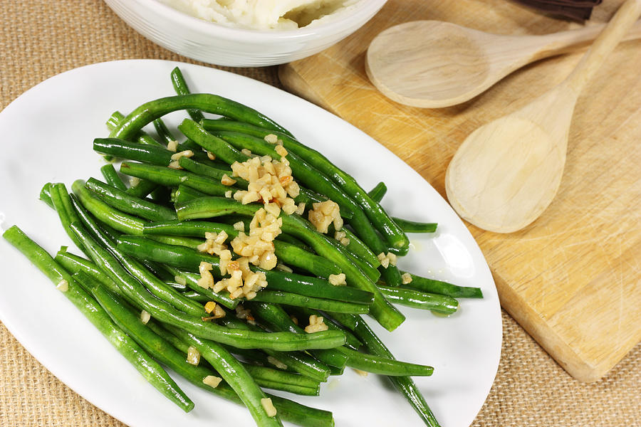 Fresh green beans serves with crushed nuts Photograph by Wsmahar