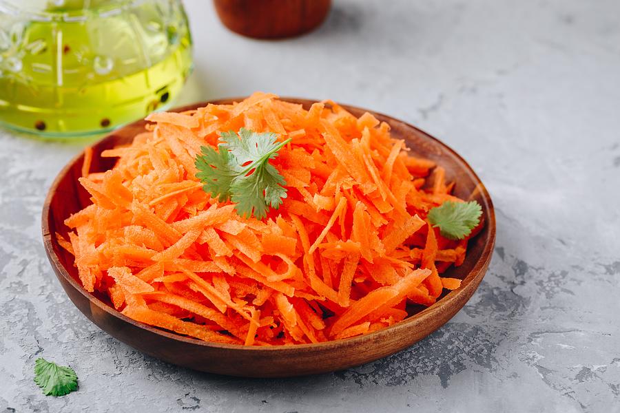 Fresh healthy grated carrot salad in bowl Photograph by Wmaster890