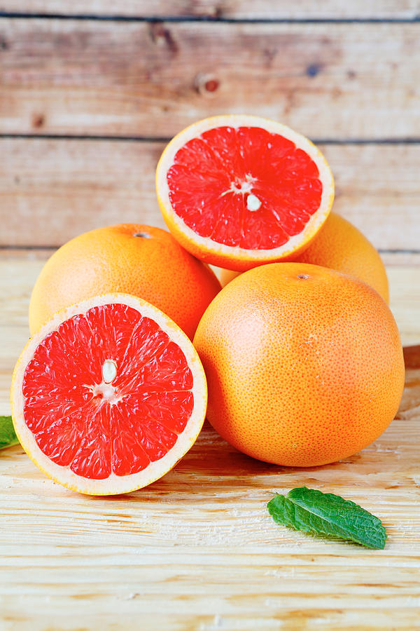 Fresh juicy grapefruit Photograph by Olha_Afanasieva