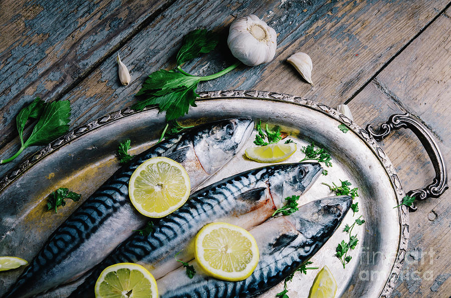 Fresh Mackerel Fish With Lemon And Spices Served On Silver Plate Photograph