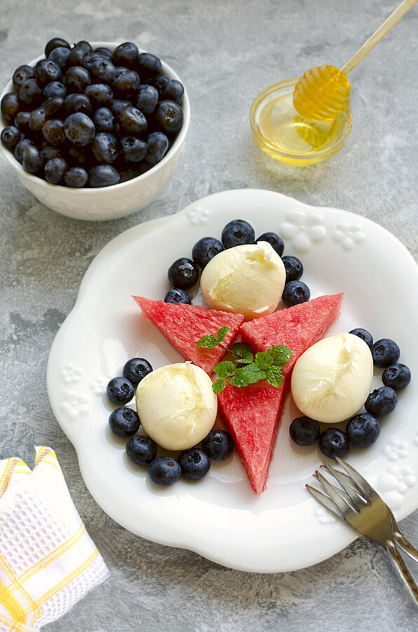 Fresh Mozzarella salad with bilberries, watermelon, mint and honey Photograph by Curly Courland Photografy