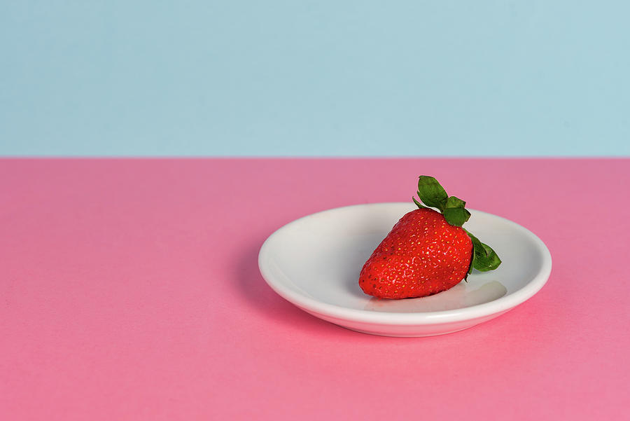 Fresh red strawberry on a white plate Photograph by Michalakis Ppalis