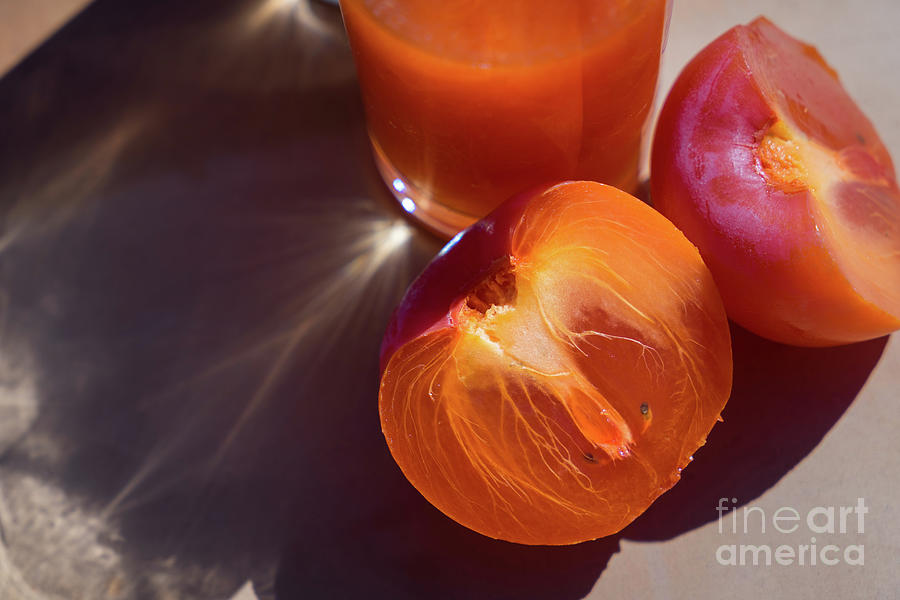 Fresh ripe persimmon and fruit drink in the sun Photograph by Adriana Mueller