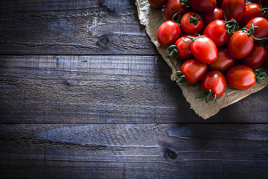 Fresh ripe tomatoes on crumpled brown paper still life Photograph by Fcafotodigital