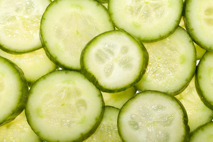 Freshly sliced cucumber Photograph by Wjarek
