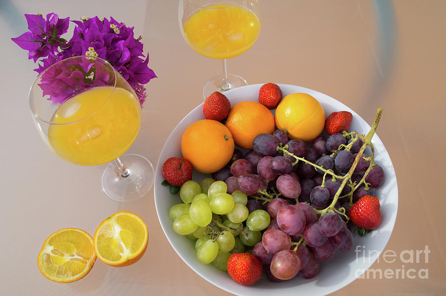 Freshly squeezed orange juice and delicious grapes Photograph by Adriana Mueller