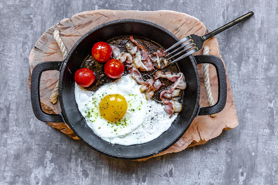 Fried Egg With Bacon And Tomatoes Photograph by Lacaosa