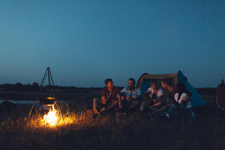 Friends camping together. Photograph by Vgajic
