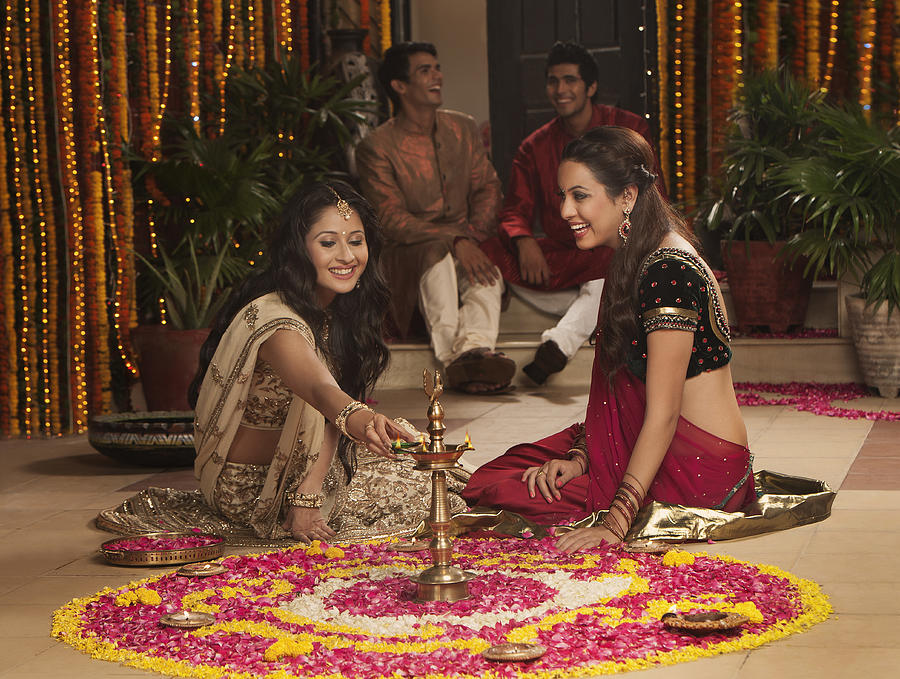 Friends celebrating Diwali Photograph by Uniquely India