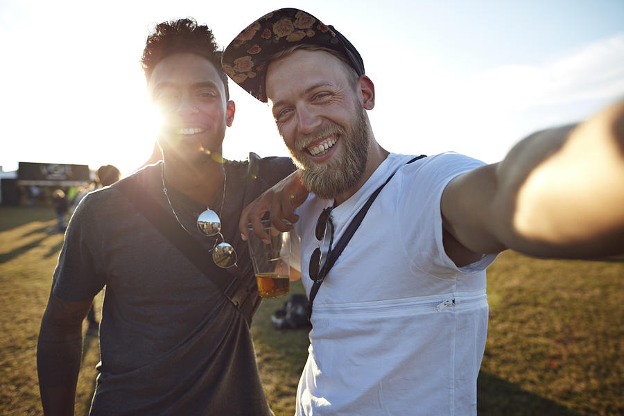 Friends making selfie at big festival concert Photograph by Klaus Vedfelt