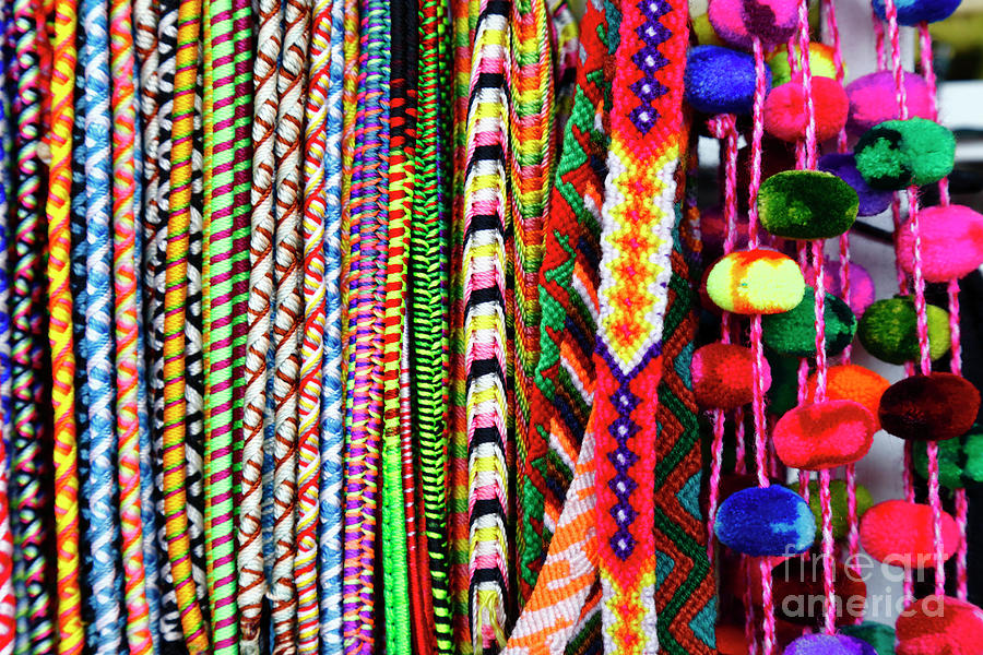 Friendship bracelets and pompoms for sale Peru Photograph by James Brunker
