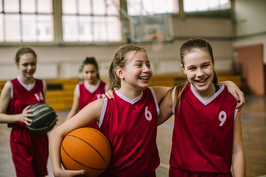 Friendship on basketball court Photograph by Miodrag Ignjatovic