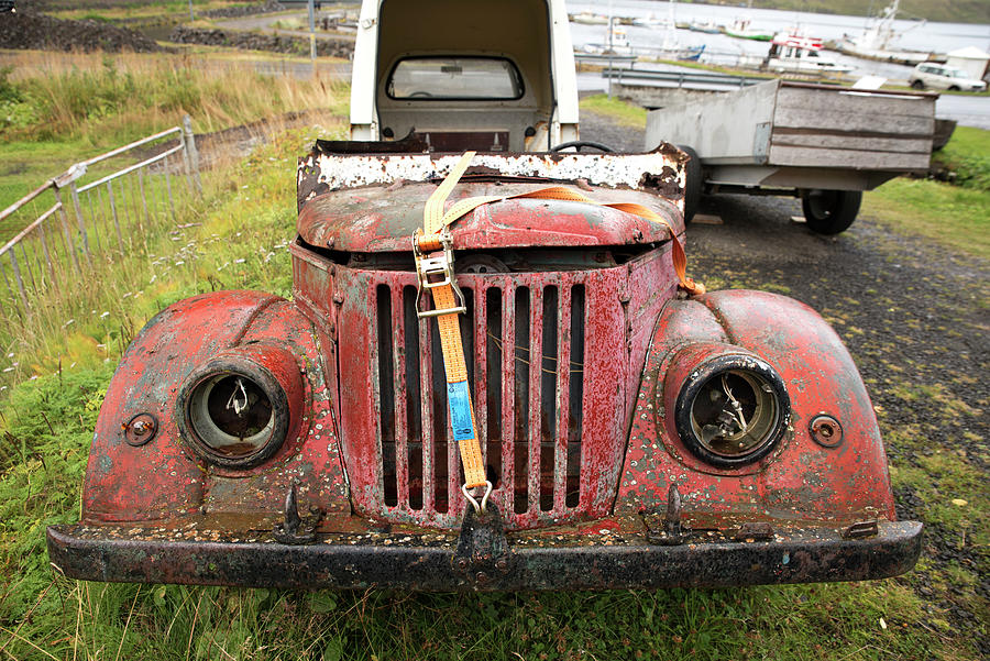 Front of an old red car in Seydisfjordur Photograph by RicardMN Photography