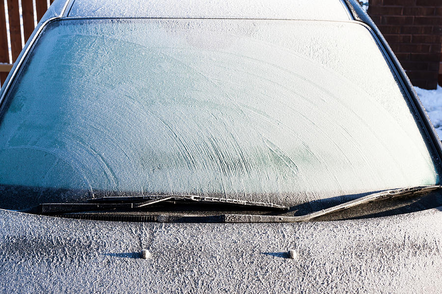 Frosty patterns on a completely covered car windscreen Photograph by R.Tsubin