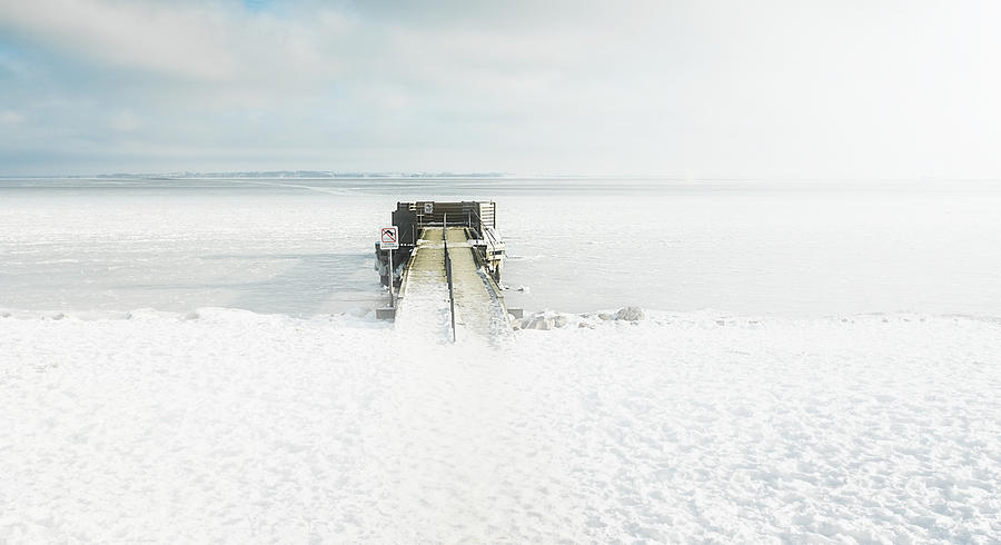 Frozen jetty in the sea Photograph by David Trood