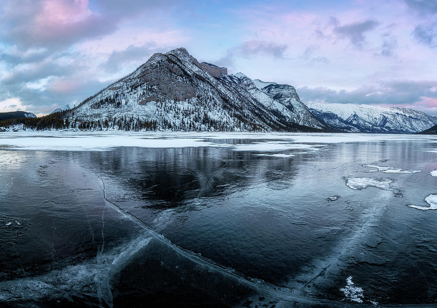 Frozen Lake Minnewanka Photograph by Alex Mironyuk