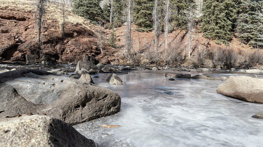 Frozen river in Colorado  Photograph by John McGraw