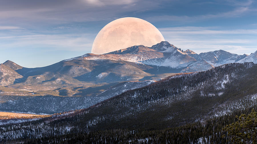 Full blood moon rising on Rocky Mountains National Park Photograph by Rod Gimenez