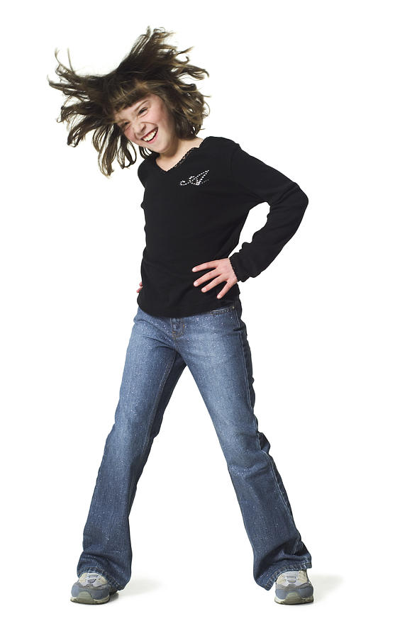 Full Body Shot Of A Female Child As She Dances And Tosses Her Hair From Side To Side Photograph by Photodisc