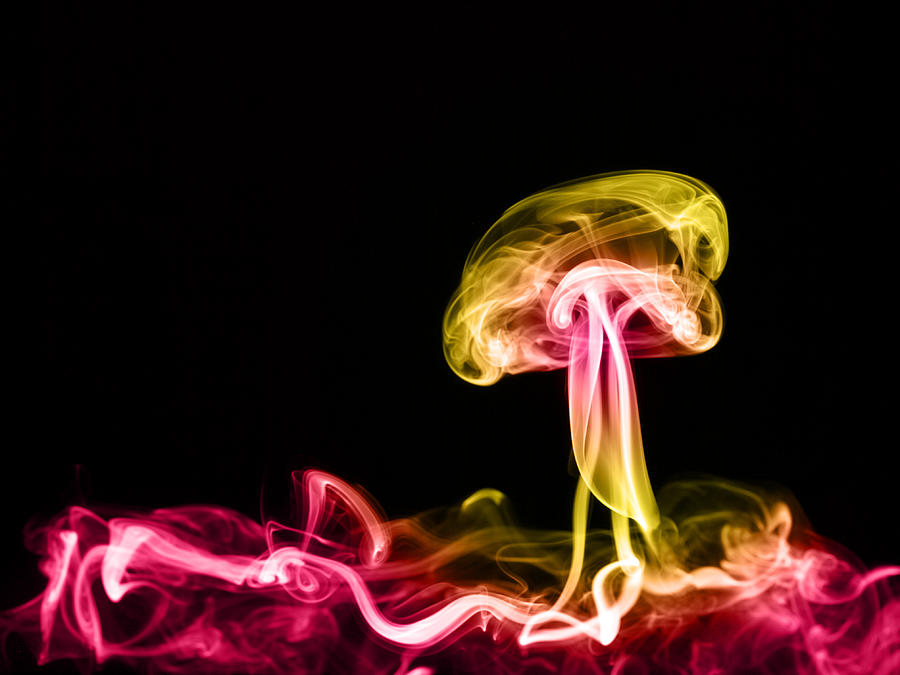 Full frame of forms and figures of smoke of colors yellow and red in ascending movement produced, by an explosion on a black background Photograph by Jose A. Bernat Bacete