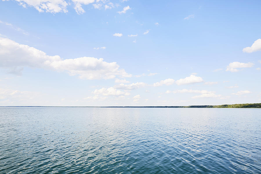 Full frame shot of lake, clouds and blue sky, backgrounds Photograph by The_burtons