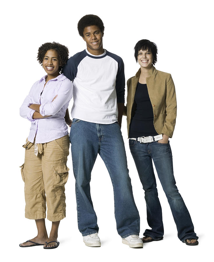 Full Length Shot Of A Group Of Three Teenage Friends As They Smile At The Camera Photograph by Photodisc