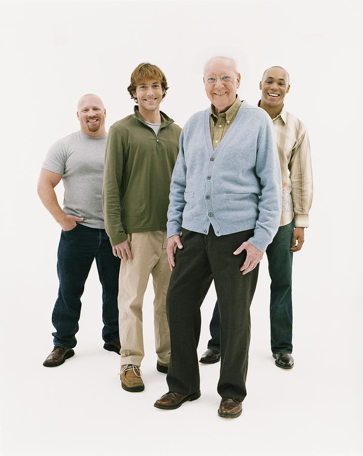 Full Length Studio Portrait of Four Smiling Men of Mixed Ages Photograph by Digital Vision.
