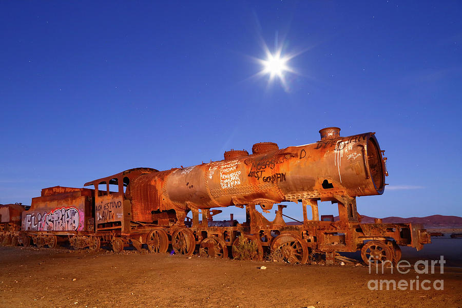 Full moon and rusting steam locomotive Uyuni Bolivia Photograph by James Brunker