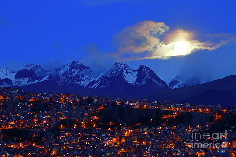 City Photograph - Full moon rising through clouds above the Andes La Paz Bolivia by James Brunker