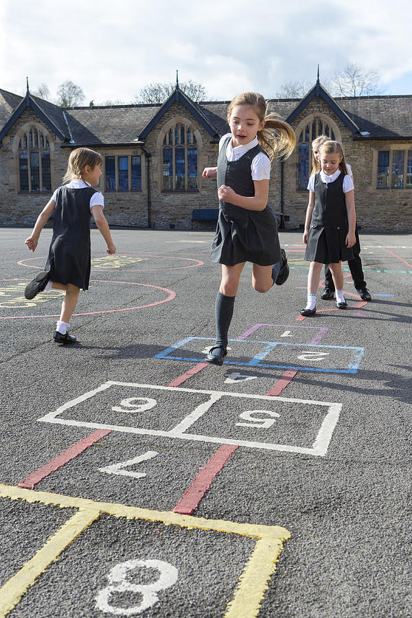 Fun in the School Yard Photograph by SolStock