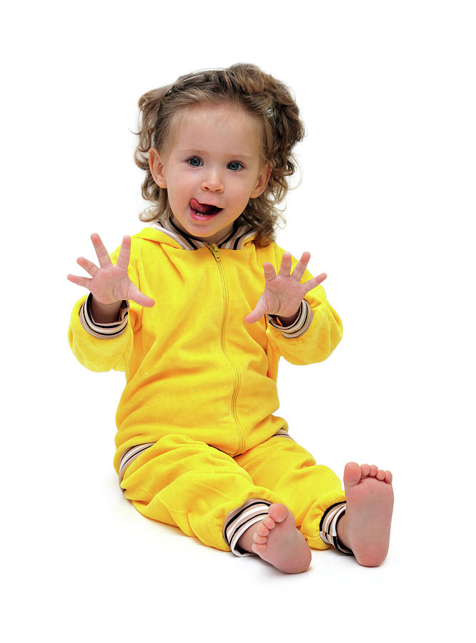 Fun Little Girl In Yellow Sitting Photograph by Mikhail Kokhanchikov