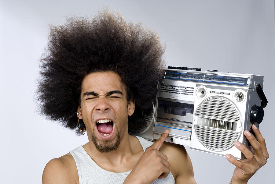 Funky Man Singing To Music On Portable Radio Photograph by Pidjoe
