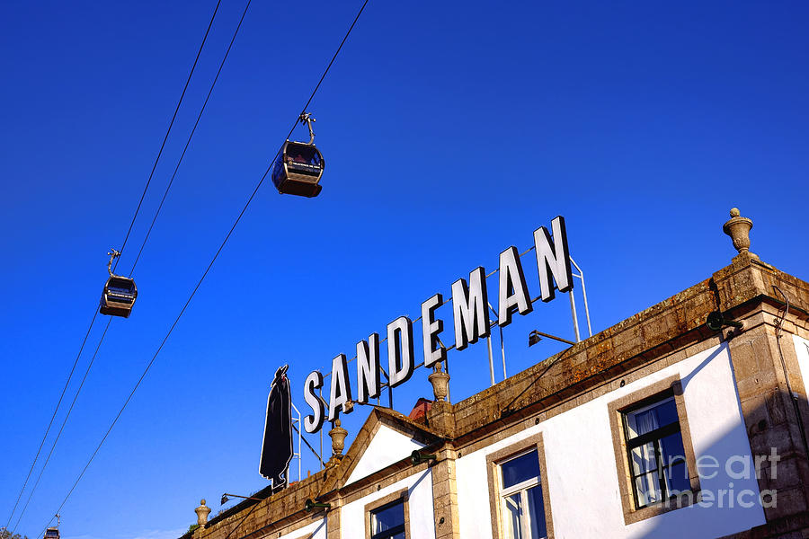 Gaia Cable Car above Sandeman Building Photograph by Olivier Le Queinec