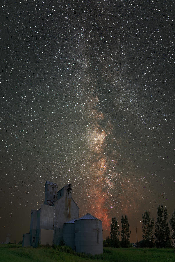 Galactic Elevator -  Summer Milky way core with grain elevator  Photograph by Peter Herman