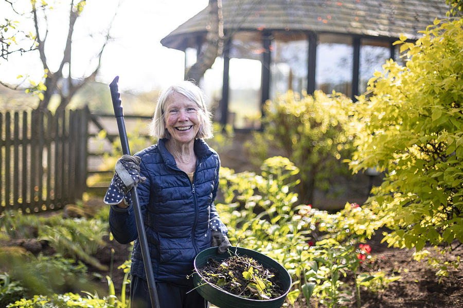 Gardening with a Smile Photograph by SolStock
