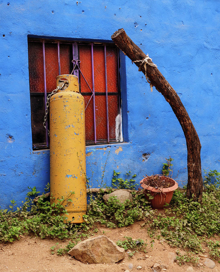 Gas Cylinder and Blue Wall Photograph by Rob Huntley