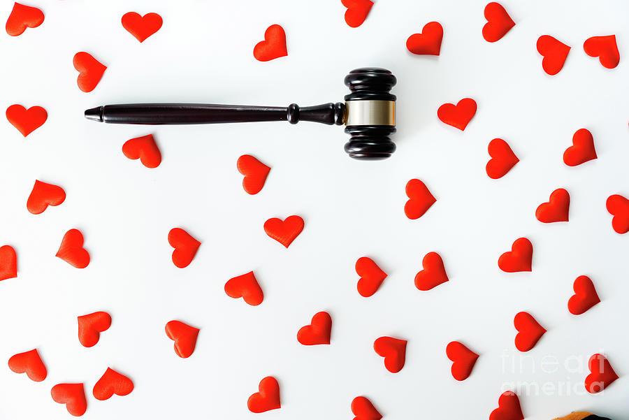 Gavel surrounded by red hearts, isolated on white, concept of le Photograph by Joaquin Corbalan