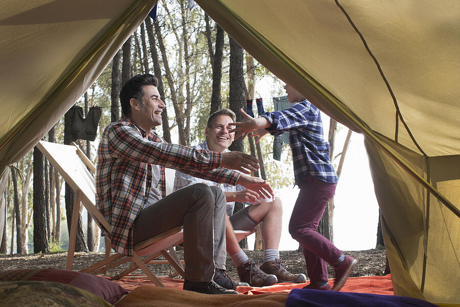 Gay male couple enjoy camping with their son Photograph by Gary John Norman