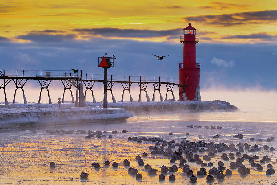 Geese sleeping on the ice by lighthouse Photograph by James Brey - Fine ...