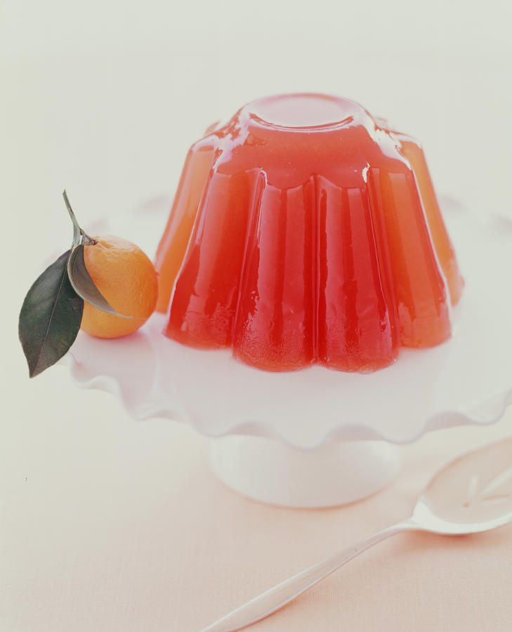 Gelatin mold on platter with orange. Photograph by Victoria Pearson