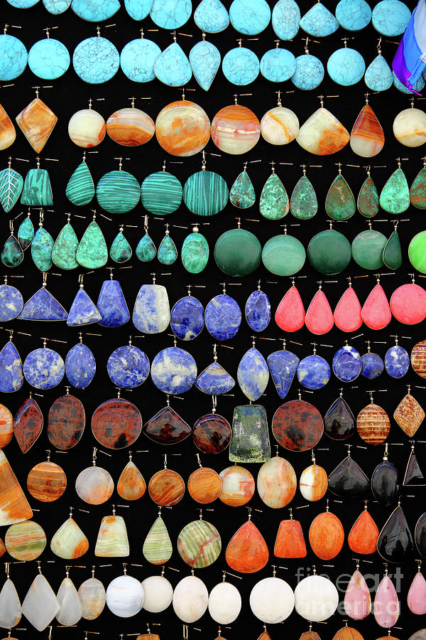 Gemstone earrings on shop display Photograph by James Brunker