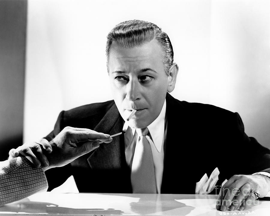 George Raft - Lighting Up Photograph by Sad Hill - Bizarre Los Angeles Archive