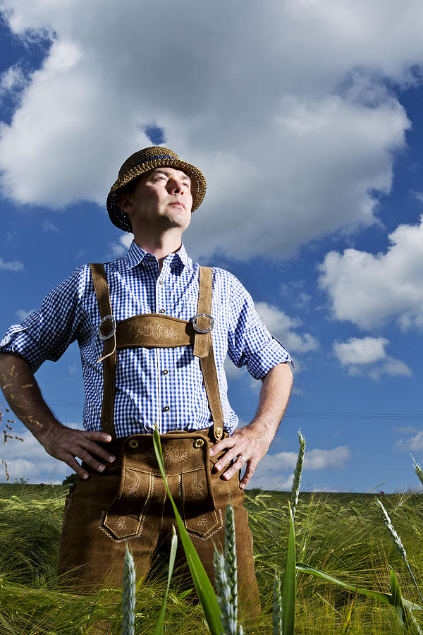 Germany, Bavaria, Farmer standing in field and looking away Photograph by Westend61
