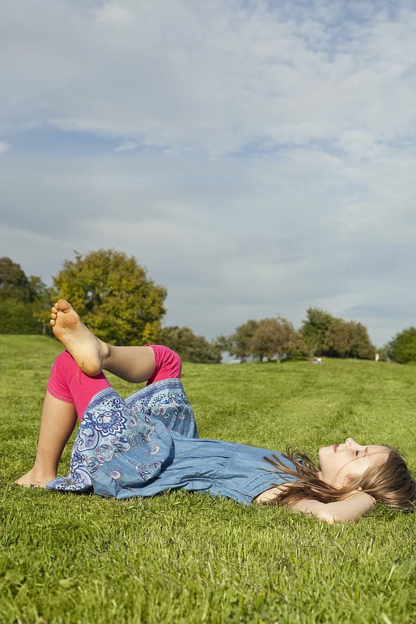 Germany, Bavaria, Girl relaxing in park Photograph by Westend61