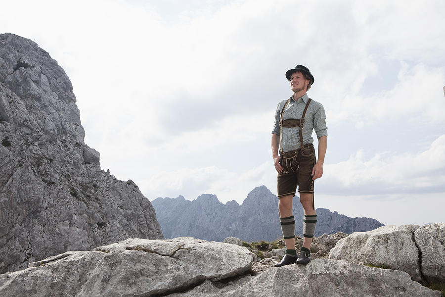 Germany, Bavaria, Osterfelderkopf, man in traditional clothes standing in mountain landscape Photograph by Westend61