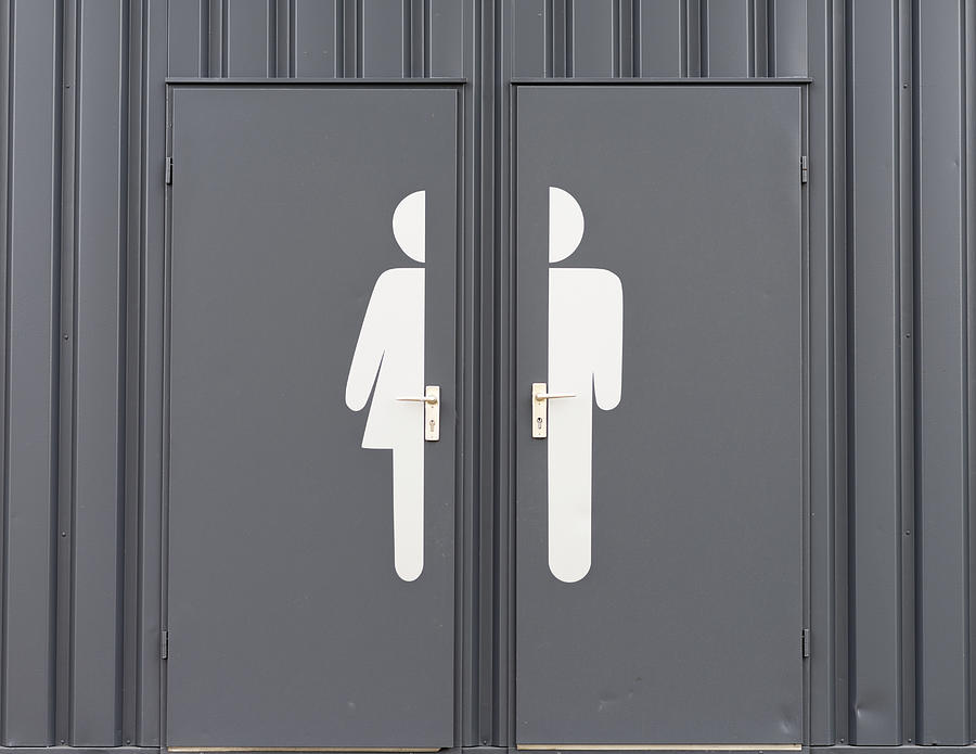 Germany, Male and female sign on toilet door Photograph by Westend61